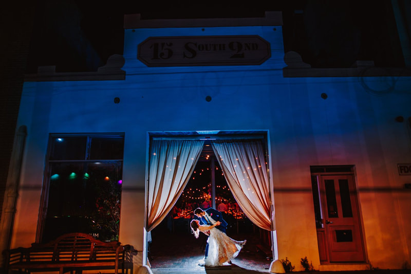The Atrium Venue, Draping over Front Entrance, Bride and Groom, Dip and Kiss, Nighttime, Wedding Day Photos, Venue Background, White Dress, Wedding Dress, Blue Tux, End of The Night, Knot Too Shabby Events, Wilmington Wedding Planner, North Carolina Wedding Planner, 